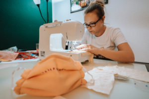 Woman sewing face mask for corona covid pandemic with sewing machine, Woman sewing face mask for corona covid pandemic with sewing machine,